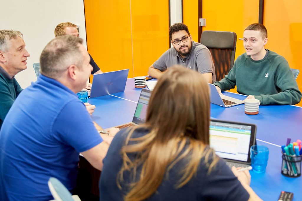 A photo of some of the EPIX team, sitting around a table having a meeting