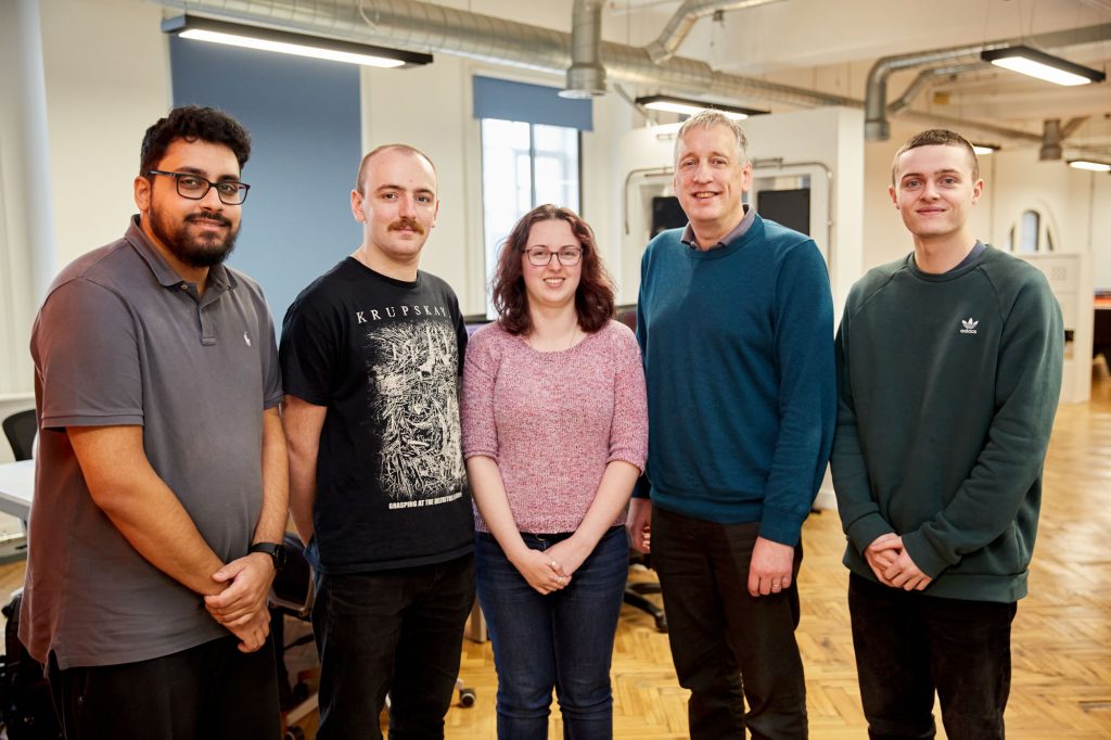 A photo of five of the EPIX team, Zahir, James, Jess, Ian and Pat, four of whom were or are EPIX degree apprentices