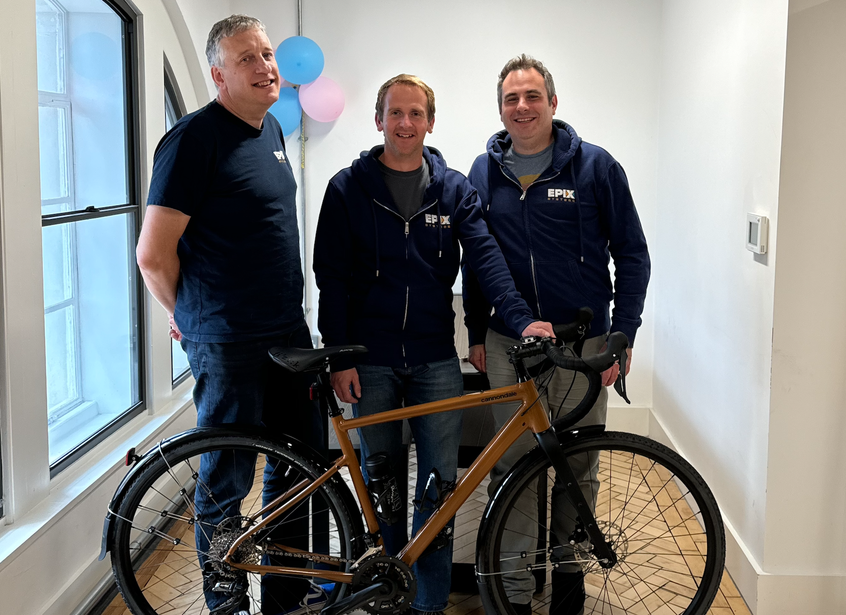 Ian, Chris and Ian with Chris's shiny new bike
