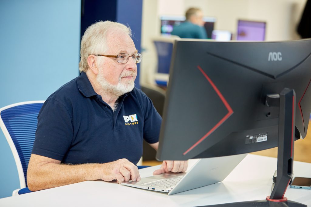 Steve pictured at a computer in the EPIX offices