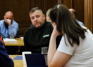 A photo of a man and woman chatting at the Open Day