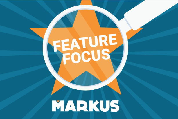 A blue graphic with a magnifying glass over an orange star and the words 'FEATURE FOCUS'
